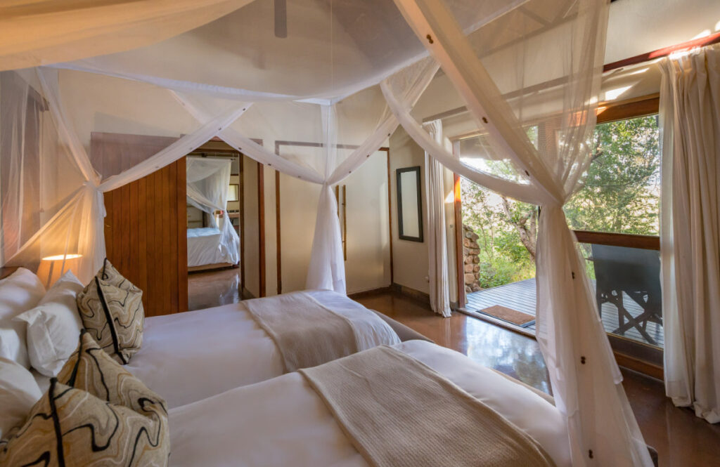 Tamboti Lodge bedroom with private deck area and scenic view